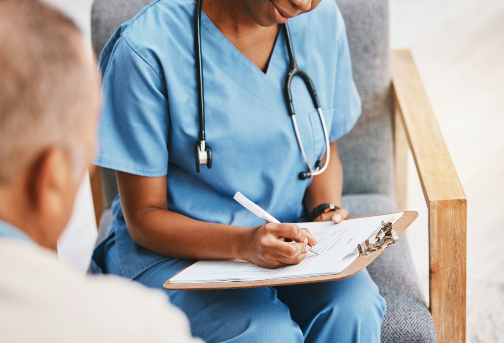 Nurse, writing notes and medical history with patient for healthcare, research or surgery planning.